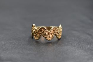 A 9ct gold decorative wave ring, having rope motif and beadwork decoration, marked 375, ring size