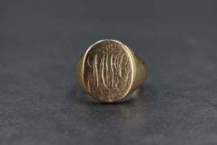 A gent's yellow metal signet ring bearing monogrammed oval cartouche, ring has been resized with