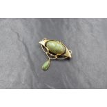 A 15ct gold Art Nouveau Murrle Bennett & Co. turquoise and seed pearl set brooch, the sinuous