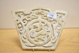 A decorative Chinese carved and pierced mottled stone Bi/Yubi type disc/carving, of circular form