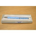 A boxed 20th-century Clarence House ball point pen, of a pale blue with foliated decal, marked to