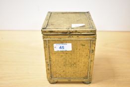 A late 19th to early 20th-century brass-clad wooden tea caddy of square form, with a removable