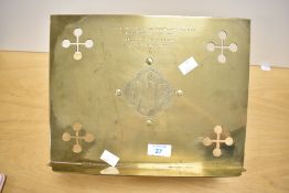 An early 20th-century brass ecclesiastical missal stand, featuring a central gothic-style