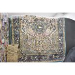 Thought to be 20th-century Persian silk-style rug, the blue ground finely hand-knotted with