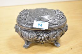 A 20th-century metal Art Nouveau-style jewellery box, of casket-form with detailed moulded grape and