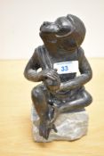 A mid-20th-century Japanese bronze monkey sculpture, presumed to be inspired by the Momotaro