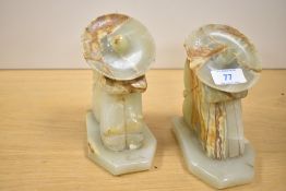 Two late 20th-century Mexican carved onyx figural bookends, depicting a man during 'siesta'