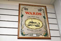 A vintage Wards Brewing Company advertising mirror, featuring floral and foliate motifs, with a gilt