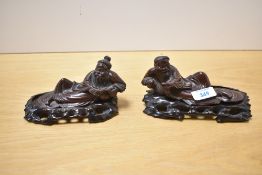 Two 19th/20th-century Chinese carved hardwood figures, possibly depicting God's, marked to base,