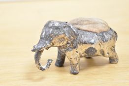 A small Victorian white metal elephant pin cushion, unmarked, 9cm in length, condition consistent