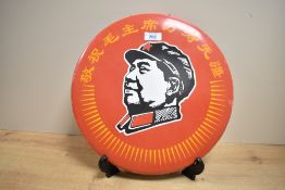 A Chinese Maoist/cultural revolution circular enamelled metal sign with silhouette image of Chairman