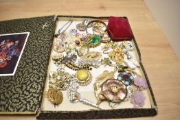 A large assortment of costume brooches, including statement pieces, paste set examples and RAF