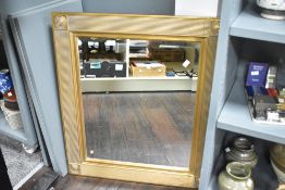 A large late 20th-century regency style gilded framed mirror, of square design, with a reeded