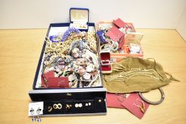 A large assortment of costume jewellery, including neck chains, faux pearls, beaded jewellery,