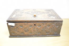 An 18th-century and later carved oak box, featuring hand carved floral and geometric decoration,