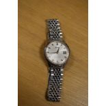 A Seiko Sportmatic automatic wristwatch, the silver tone dial having baton numerals and date