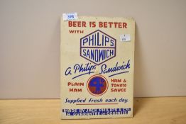 A vintage Jack and Phillips Company cardboard advertisement for “Phillips Sandwich” products,