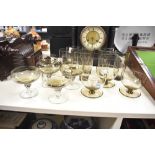 A selection of 20th-century 'smokey' studio art glass, featuring five twisted base coupes; three