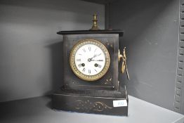 A Victorian black slate mantel clock, having a knopped gilt metal finial top over an enamelled