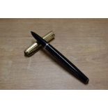 A Parker 51 vacumatic fill fountain pen in Black (twin jewel) with Gold fill parallel line cap.