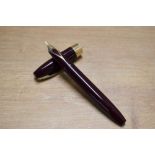 A boxed Sheaffer Pen For Men III snorkel fill fountain pen in Burgundy with Gold trim having