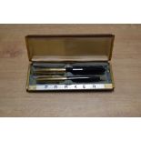 A boxed Parker 51 vacumatic fill fountain pen and Pencil set in Cordovan Brown with Gold Fill