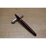 A Parker 51 aerometric fill in Burgundy with Rolled Silver converging line cap with gold clip. Circa