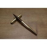 A boxed Parker Falcon Insignia converter fill fountain pen in Gold