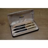A boxed Parker 61 Custom Insignia capillary fill fountain pen, ballpoint pen and pencil set in Black