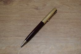 A Parker 51clutch pencil in Burgundy with Rolled Gold converging lines cap. Circa 1953