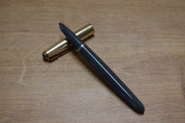 A Parker 51 aerometric fill fountain pen in Navy Grey with Rolled Gold cap. Circa 1959. Some rubbing