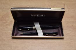 A boxed Sheaffer Valiant/Statesman snorkel fill fountain pen and rotary pencil set in Black pen