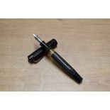 An Osmia 74 BBL piston fill fountain pen in Black barley Vertical stripe having Osmia Supra nib.