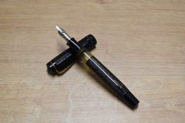 An Osmia 74 BBL piston fill fountain pen in Black barley Vertical stripe having Osmia Supra nib.
