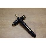 A Conway Stewart 58 lever fill fountain pen in Black Cracked Ice with single broad and two narrow