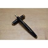 A Parker Vacumatic fountain pen in Brown Shadow Wave design with two narrow cap band having Parker