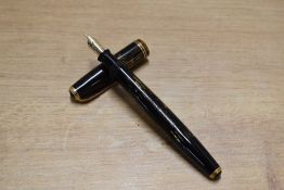A Parker Vacumatic fountain pen in Brown Shadow Wave design with two narrow cap band having Parker
