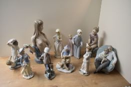 A large assortment of Nao by Lladro and similar porcelain figures/figurines to include 'My Little