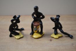 A group of three unusual Goebel porcelain figures depicting a drummer and two dancers, all in matt