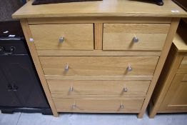A modern Corndell Nimbus range light oak chest of two over three drawers. Dimensions approx. W81 D42