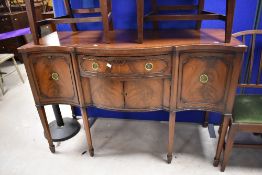 A reproduction Regency mahogany sideboard having shaped front , width approx. 139cm, height 9cm,
