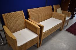 A nice quality modern beech and wicker three piece suite, settee width approx. 134cm