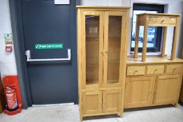 A modern Corndell Nimbus range light oak finish bookcase having glazed shelved section over double