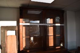 A Victorian mahogany full height bookcase having glazed section over double cupboard, dimensions