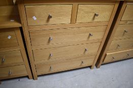 A modern Corndell Nimbus range light oak chest of two over three drawers. Dimensions approx. W81 D42