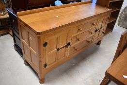 Workshop of Robert Mouseman Thompson of Kilburn; A golden oak sideboard, with three central