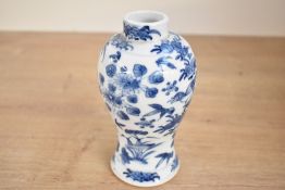 A Chinese blue and white porcelain prunus vase, presumed Kangxi period, of ovoid form with short