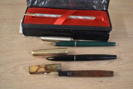 Two Parker fountain pens. A Parker Moderne button fill in Brown Marble with Parker Fountain Pen