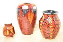 Three 20th-century Poole Pottery vases, to include a 'Volcano' and a 'Strobe' example, all marked to