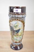 A Victorian King Austria ceramic black grouse vase, modelled with a raised relief of a tertiary